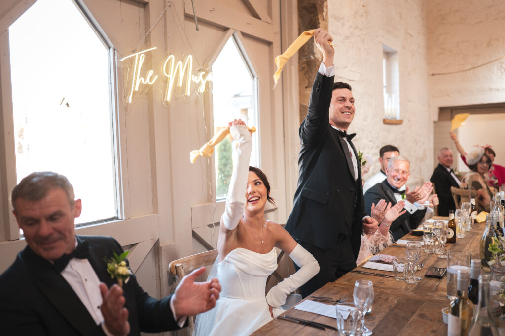 Waving napkins after speeches.