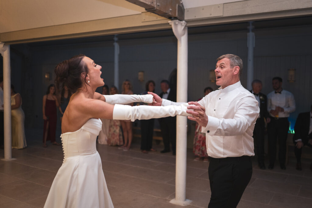 Rachel & her dad dancing.